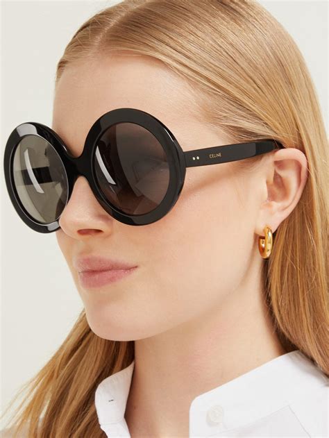 oversized round black sunglasses.